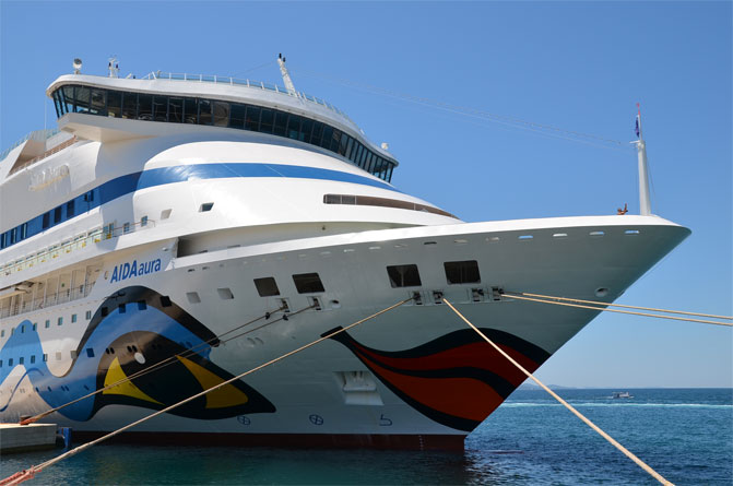 Image of the bow of a cruise ship. Cruises are a great way to relax and to see several places in a short amount of time. Here are three ways to save money on a cruise.