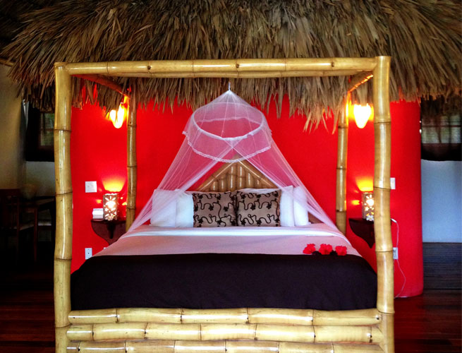 An image of a luxurious hotel bed. How to fall asleep at a hotel - tips from RoamRight