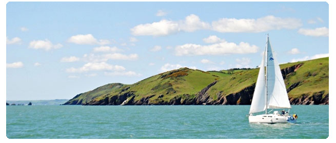 Image of a sailboat on the English Riviera. There are many activities for travelers in the English Riviera. Check out these ideas on what to do there.