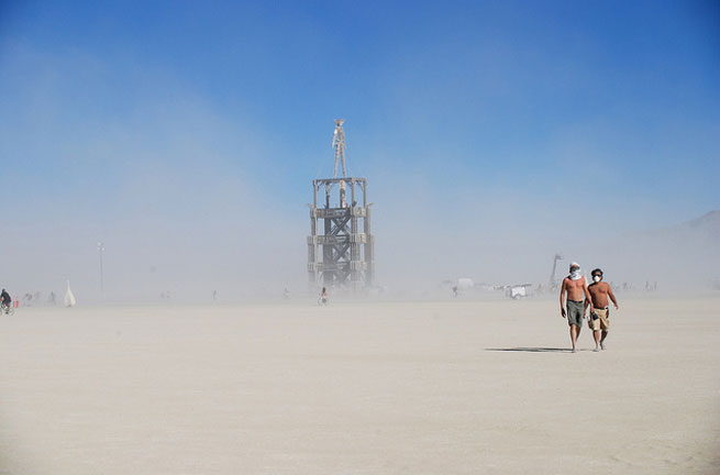 The Burning Man stands tall over the desert during the festival. The Burning Man Festival is a unique experience that takes place in the desert each year.