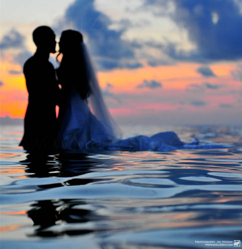 Honeymoon is the traditional holiday taken by newlyweds to celebrate their marriage in intimacy and seclusion 