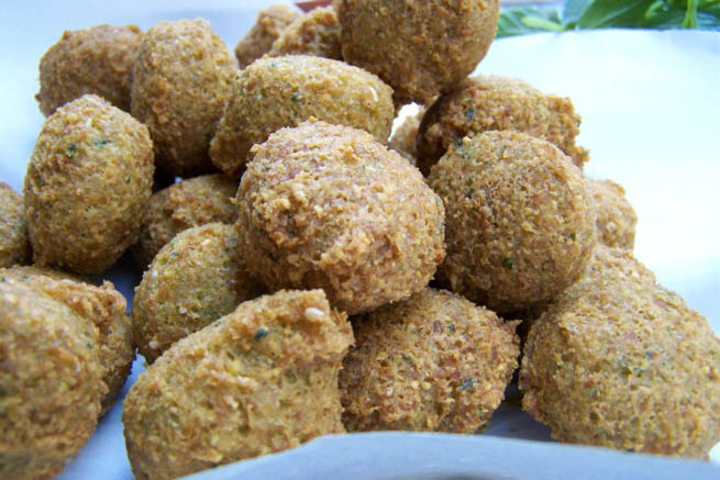 Falafel is a deep-fried ball or patty made from ground chickpeas, fava beans, or both CT