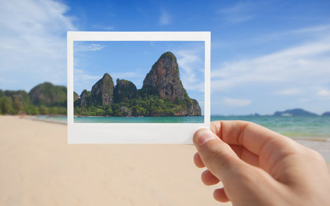 Picture of a beach with a bright blue sky and mountains in the background. Enter the RoamRight Venture Farther Photo Contest for your chance to win a $500 airline gift card to the US airline of your choice.