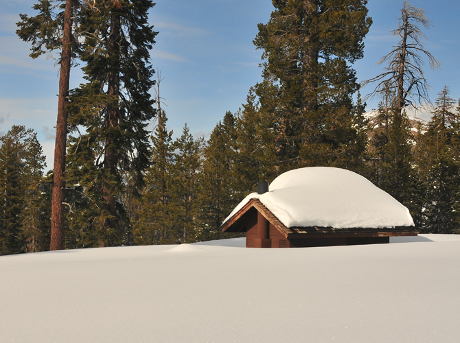Cabin Buried in Snow